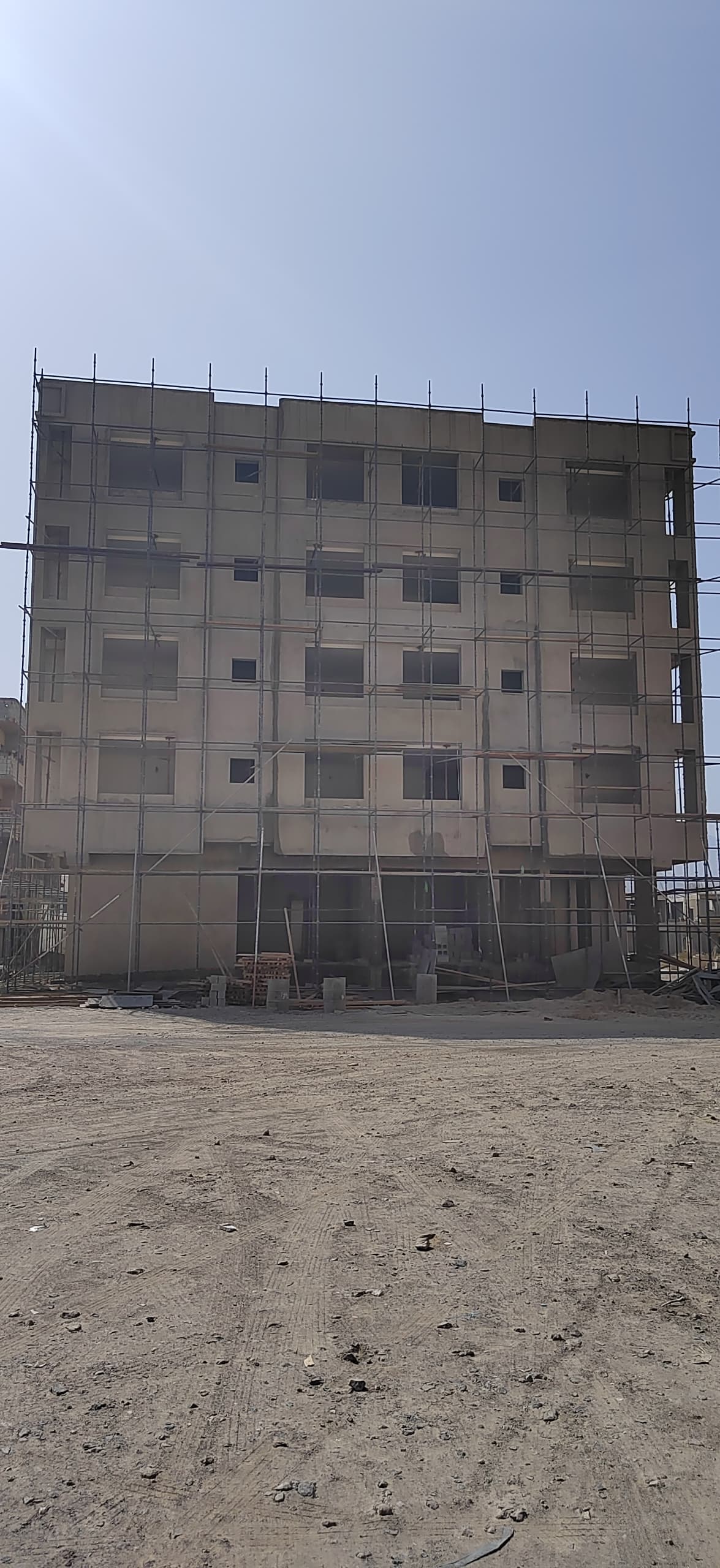 A sixteen-unit two-bedroom flat building with ground-floor offices — view 2